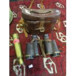 A pair of leather cased WWI military issue Ross, London stereo-prism binoculars Rd74505, and a brass