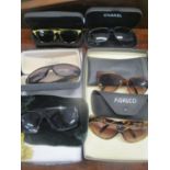 A selection of ladies sun glasses with cases