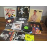 Mixed records and tapes to include an Elvis Collectors gold edition, Andy Williams, Diana Ross and