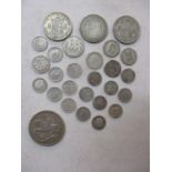 A small quantity of early 20th century British coinage to include a 1935 crown, half crowns,