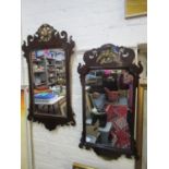 Two similar early 20th century Queen Anne style mahogany fretwork wall mirrors, each crested with