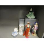 A small group of porcelain ornaments to include an Atlas China Bathing Belle figurine, a Goebel lady