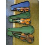 Three early 20th century violins in cases, one with a bow, another with label for Antonius