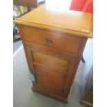 A Victorian walnut cabinet with a door and drawers, on a plinth, 100"h x 50"w