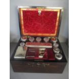 A Victorian rosewood vanity box having mother of pearl inlaid and fitted with dressing table