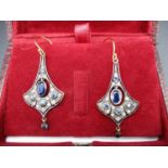 A pair of silver flared drop earrings set with a central sapphire and diamonds, boxed Location: CAB