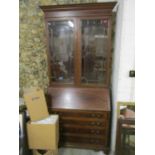 An inlaid mahogany Edwardian bureau bookcase, stepped pediment over twin astragal glazed display