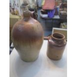 A 18/19th century two tone brown glazed flagon and a later jar