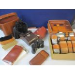 A mid 20th century gents leather vanity travelling case and contents together with binoculars, a