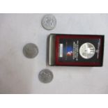A boxed silver proof 1984 Olympic dollar together with a 1971 dollar and two 1976 dollar coins