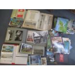 A selection of postcards, loose and in albums, together with an album of newspaper cuttings