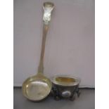 A Scottish silver sauce ladle, together with a continental white metal bowl having three painted