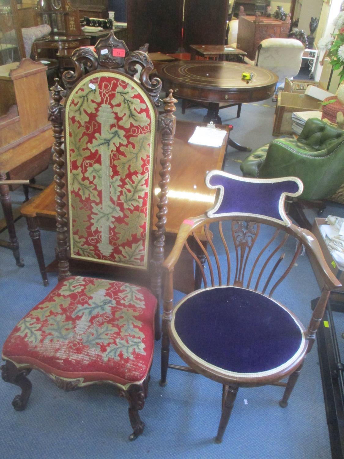 A Victorian rosewood nursing chair having tapestry upholstery, barley twist supports and crest to