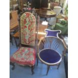 A Victorian rosewood nursing chair having tapestry upholstery, barley twist supports and crest to