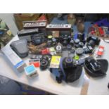 A selection of vintage cameras to include Nikon, Zenit, Pentax, together with lenses and three