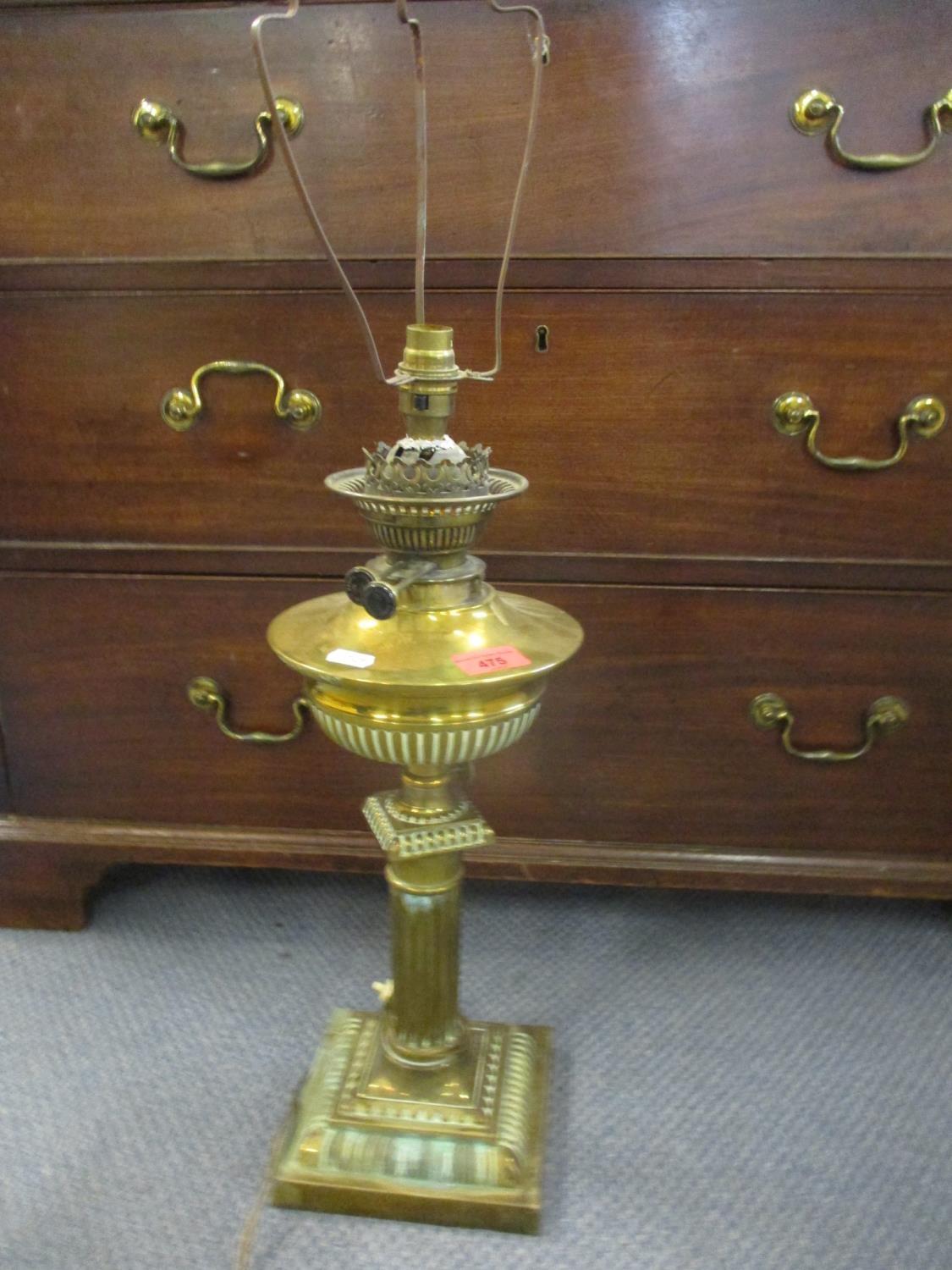 An early 20th century brass column table lamp converted from an oil lamp