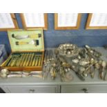 A quantity of silver plated items to include a cased set of fish servers and forks