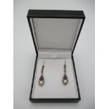 A pair of silver drop earrings set with pearls, rubies and diamonds, boxed Location: CAB