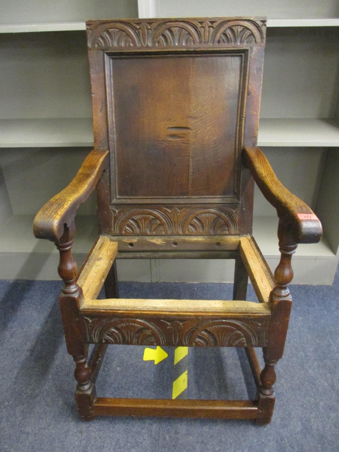 A 17th century carved oak armchair in the Wainscot style A/F