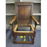 A 17th century carved oak armchair in the Wainscot style A/F