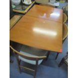 A mid 20th century retro Nathan extending dining table and five chairs