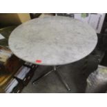 A modern circular marble topped occasional table on chrome supports, 74"h x 90"w