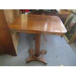 A 19th century rosewood pedestal table with an octagonal column, on button feet, 67"h x 51"w