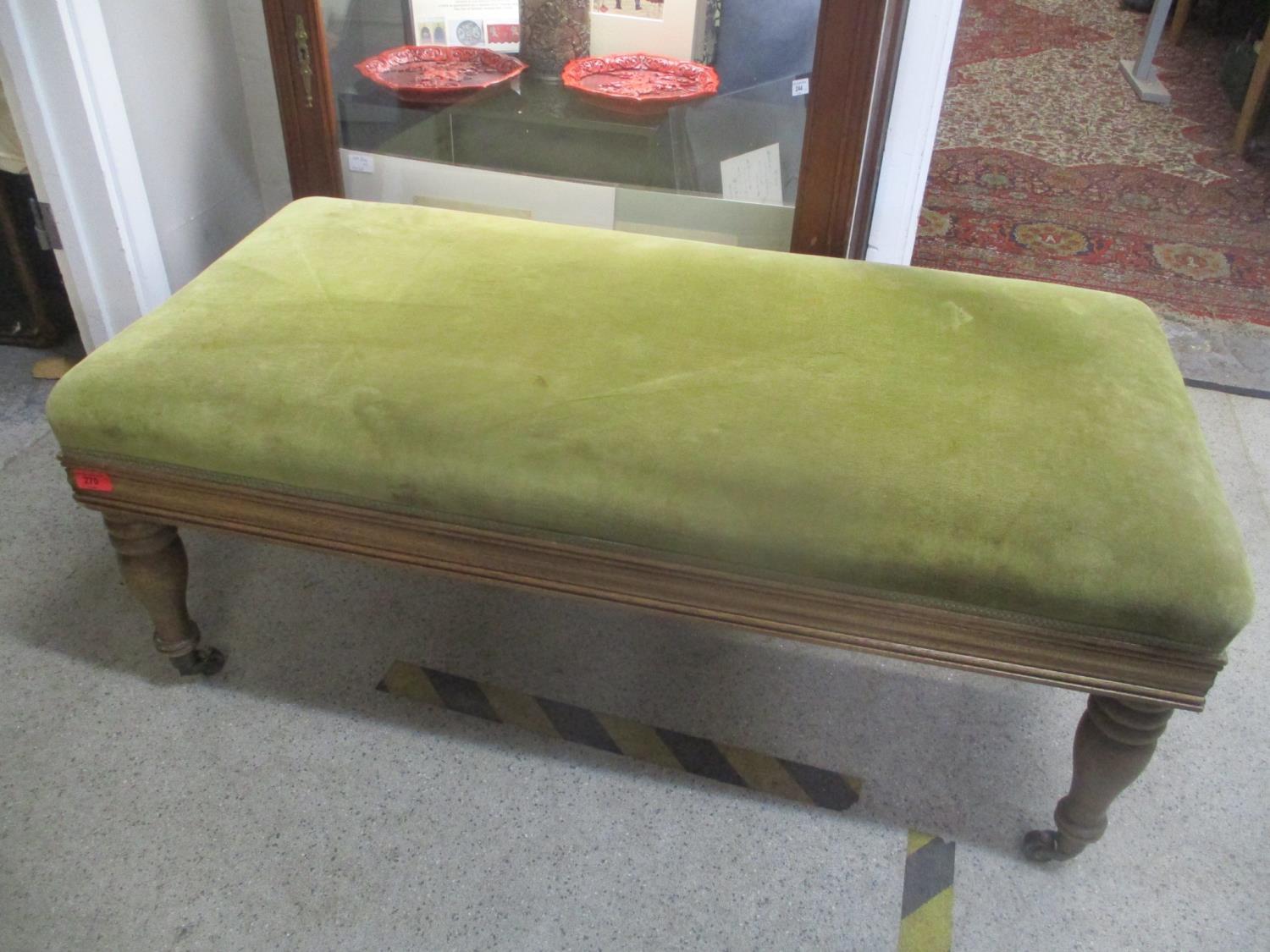 A modern reproduction mahogany stool on four turned short legs, 43 cm h x 106 cm w
