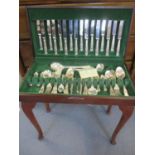 A silver plated canteen of Kings pattern flatware and cutlery in a case on cabriole legs