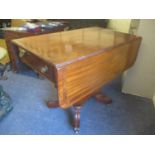 A Regency mahogany fall flap Pembroke table having a single drawer and a quadrofoil base, 73"h x