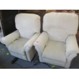 A pair of modern reclining electric armchairs