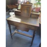 An Edwardian walnut ladies writing table having string inlaid and single drawer above a sliding wool