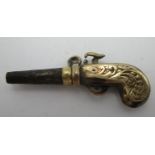 A gold coloured metal and steel watch key fashioned as a pistol with a ratchet mechanism Location: