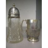 A Victorian silver Christening mug and a silver topped glass sugar caster