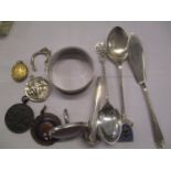 Silver to include teaspoons, a butter knife, a yellow metal and enamel pendant, along with other