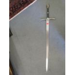 A Lord of the Rings replica sword of Strider, circa 2002, made by United Cutlery of Taiwan with wall