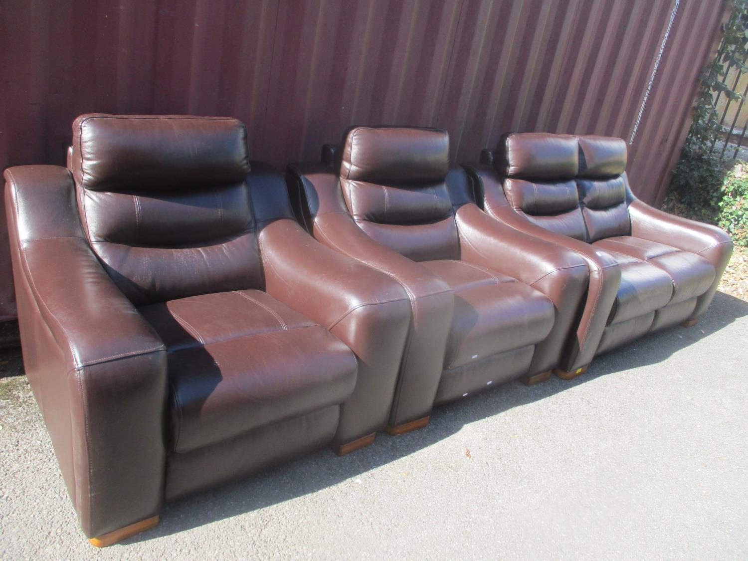 A modern brown leather two seater sofa and a pair of matching armchairs Location: C/LAM