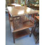 An early 20th century mahogany table with later adjustments having an Oriental style swivel top 76