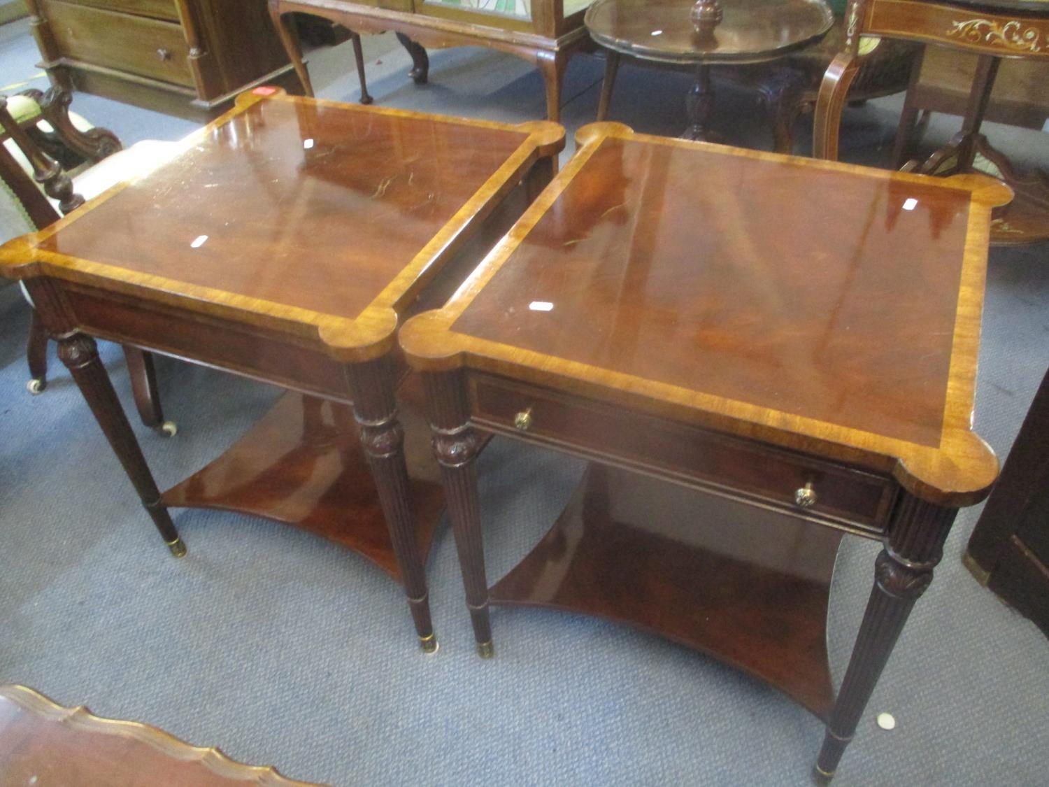 A pair of modern mahogany two tier side tables having inset drawers, two brush slides, fluted