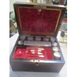 A 19th century rosewood dressing table box fitted with silver plated topped jars and other items