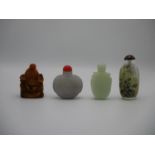 A collection of 20th century Chinese snuff bottles comprising a lavender jade model with central