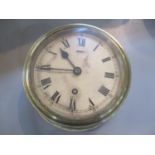 An early 20th century brass cased ship's clock 20 1/2 cm d