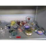 A collection of paperweights and a table lighter to include Strathearn and an Isle of Wight