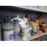 A mixed lot of ceramics and African treen items to include a Royal Doulton vase A/F, tankards, a