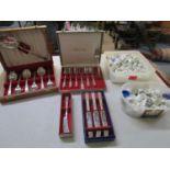 A collection of porcelain thimbles and boxed sets of Community plate cutlery