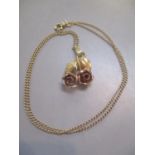 A 9ct gold chain and rose pendant 4.30g