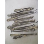 A selection of Victorian and later silver handled button hooks