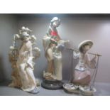 Three Lladro oriental style figures of fish sellers, a mother and child and a young girl by a tree