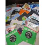 Two 1960s Beatles 45rpm records, A Hard Days Night and All you Need is Love by EMI Records Ltd,