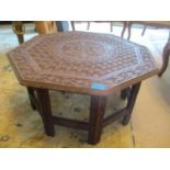 A carved teak hardwood occasional table, 12 3/4"h x 24"w Location: C